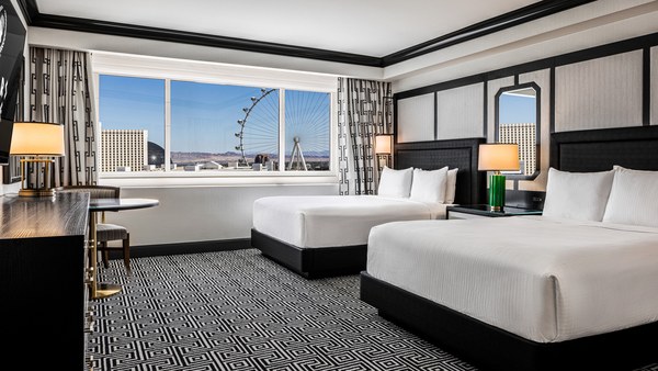 Hotel room with two beds and a wide window view at Caesars Palace