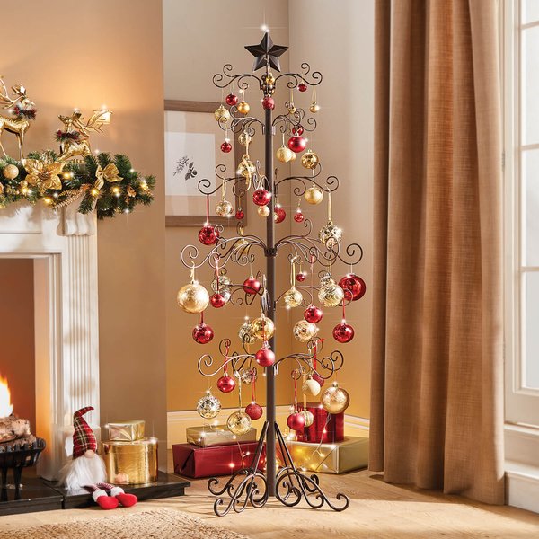 Floor-standing black metal Christmas tree with star top decorated with red and gold baubles