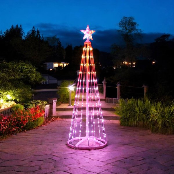 1.5m RGB LED smart Christmas tree with star top lit up on a garden path at night