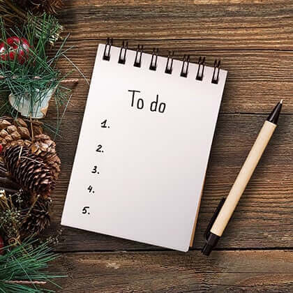 A to-do list notepad with pine cones for seasonal home jobs