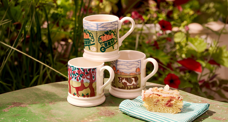 Emma Bridgewater half pint mugs with cake on a garden table