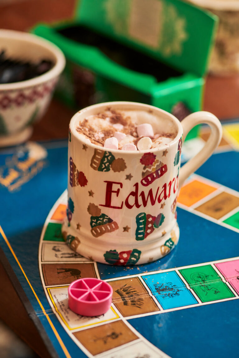 Emma Bridgewater Personalised Christmas Mugs: Which Size to Choose, From Tiny to Teapot Emma Bridgewater Personalised Bobble Hats mug with hot chocolate on a board game