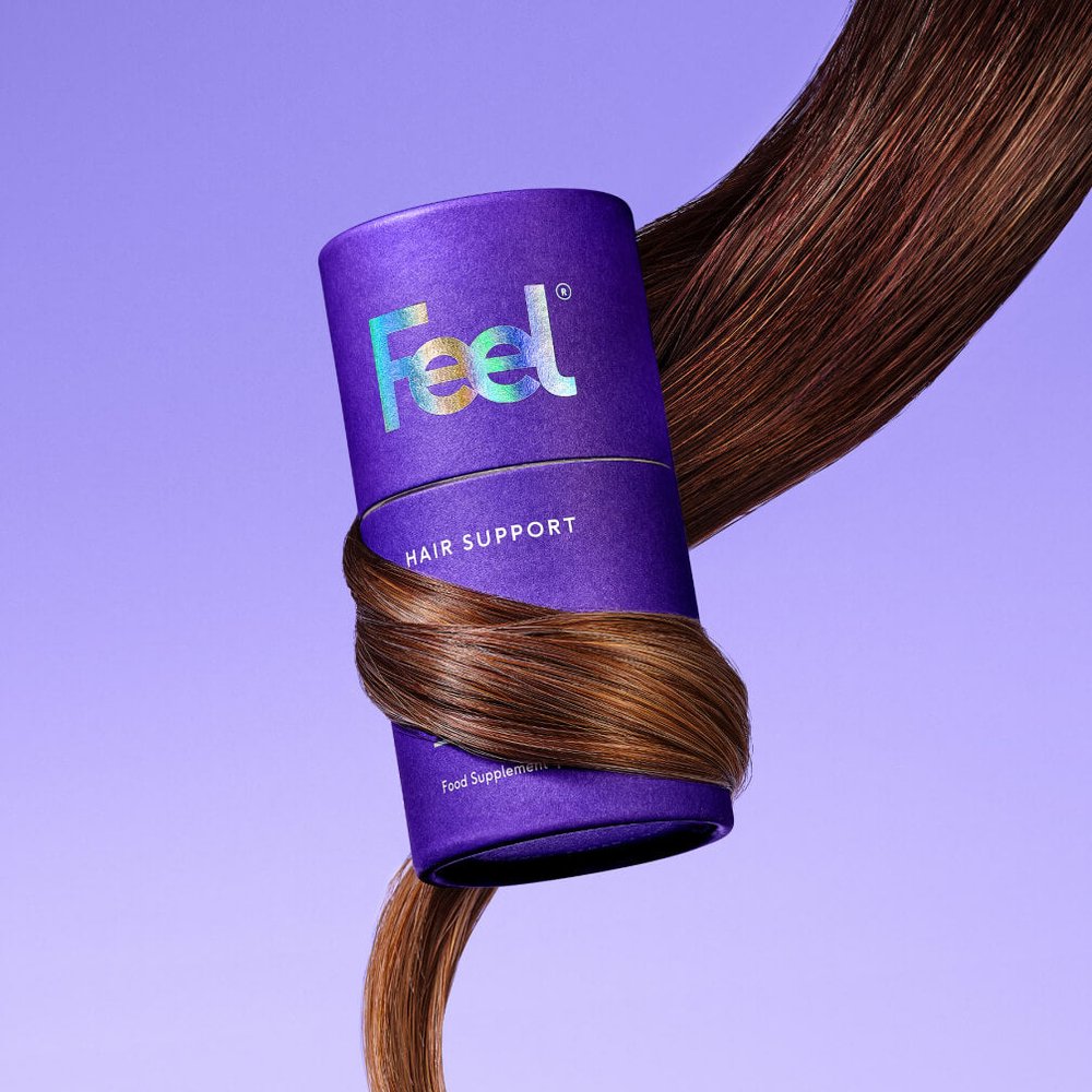 Feel Hair Support tub wrapped in a lock of brown hair