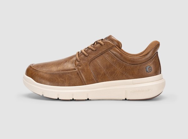 A caramel brown FitVille EasyWalk slip-on dress shoe with a cream sole