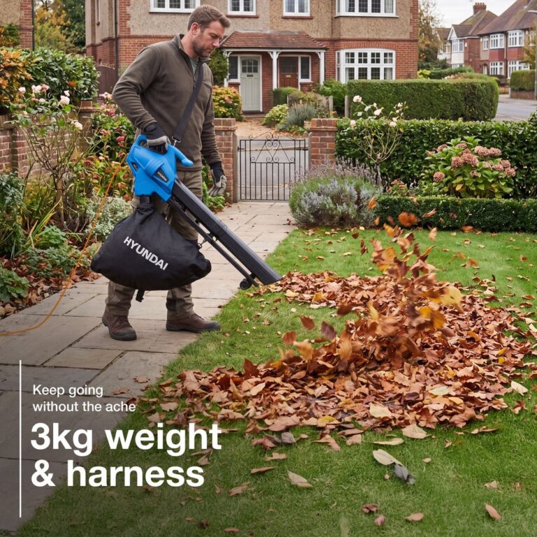 Gardener clearing autumn leaves with the Hyundai 3-in-1 leaf blower vacuum