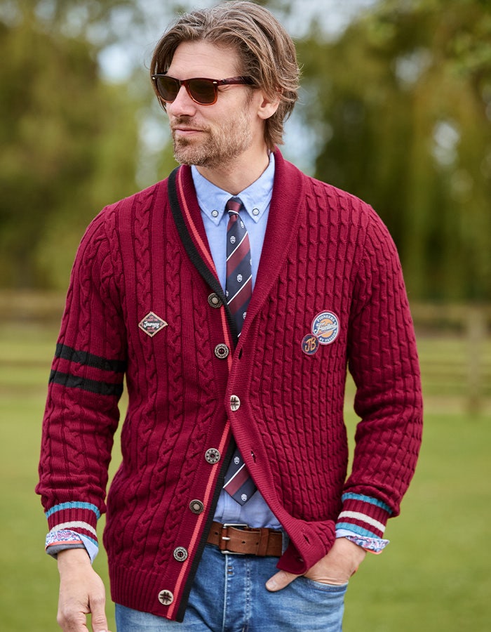 Joe Browns red preppy cardigan worn with a shirt and tie
