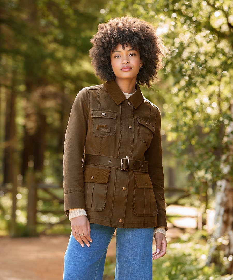 Woman in the brown Joe Browns Remarkable Belted Wax Jacket outdoors