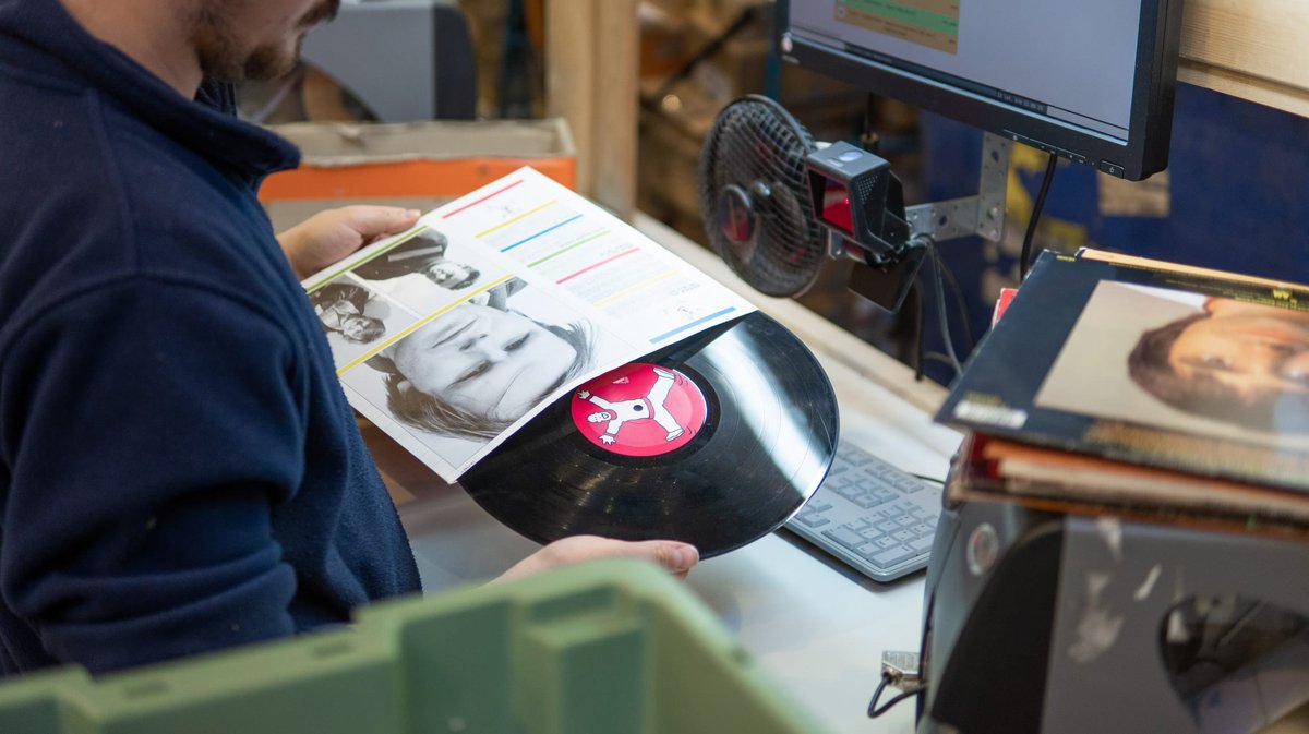 Second-hand books being inspected at a momox quality control station