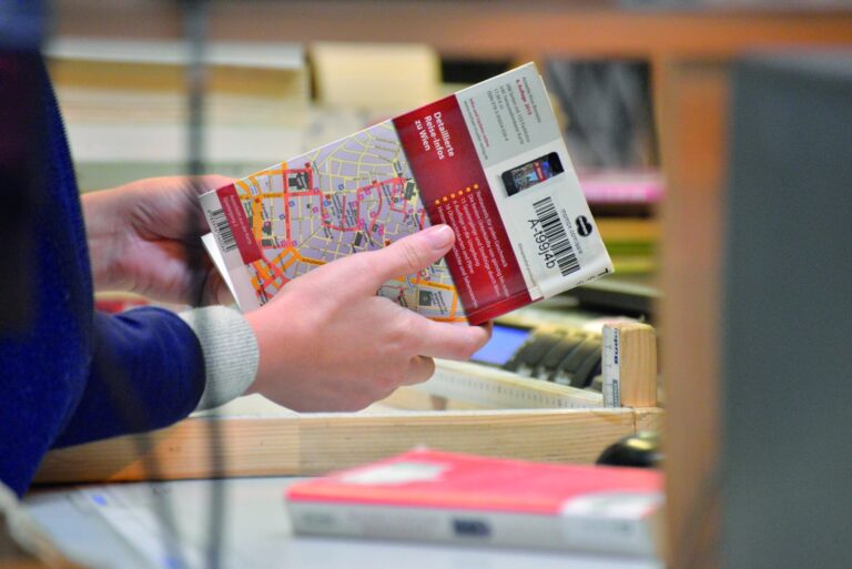 A momox employee checks the condition of a second-hand book in the warehouse