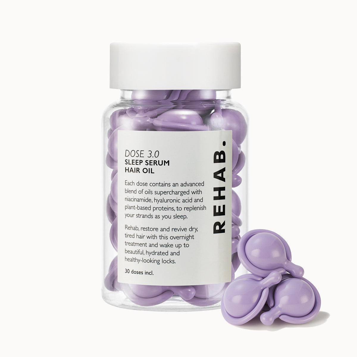 REHAB. Dose 3.0 Sleep Serum Hair Oil bottle with purple capsules