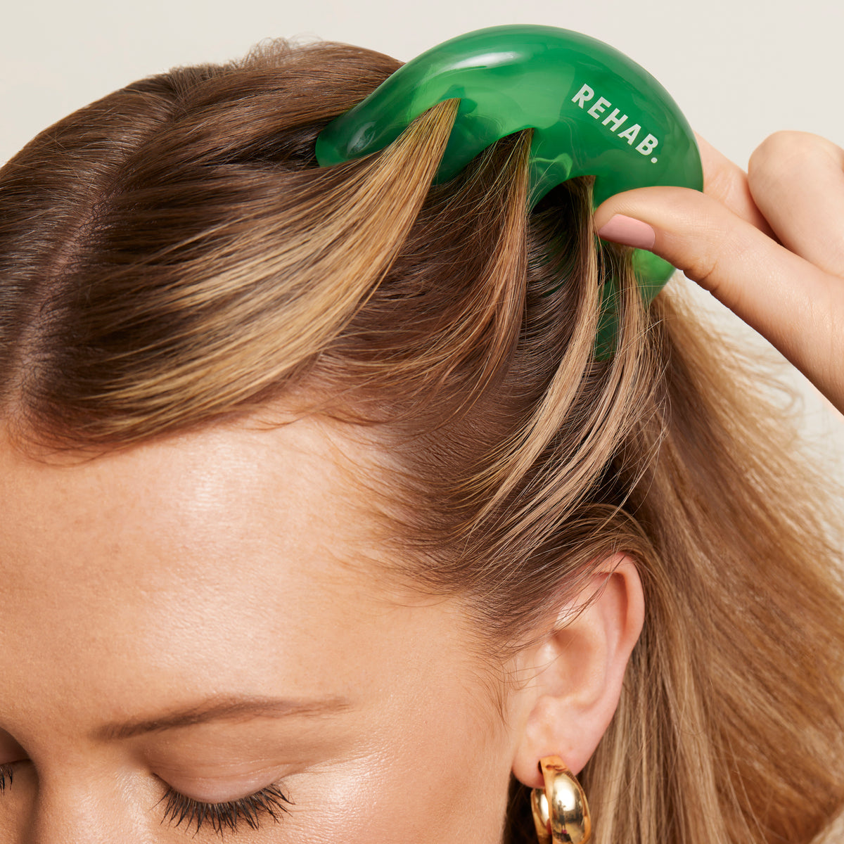 REHAB. Oiling Comb being used on the scalp