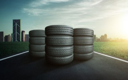 Car tyre and alloy wheel on the open road
