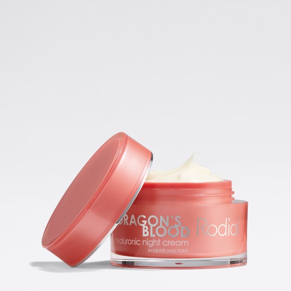 Open jar of Rodial Dragon's Blood Hyaluronic Night Cream with the lid beside it