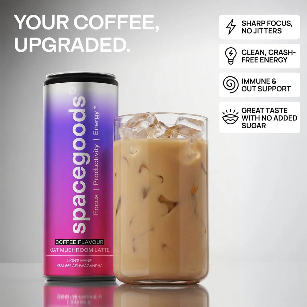 Spacegoods Oat Mushroom Latte can next to a glass of iced coffee