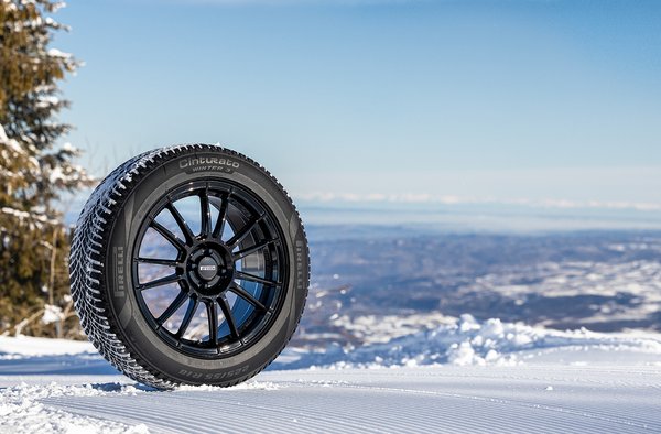 Pirelli Cinturato Winter 3 tyre standing in snow above an alpine valley