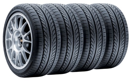 Row of car tyres with alloy wheel showing the tread width