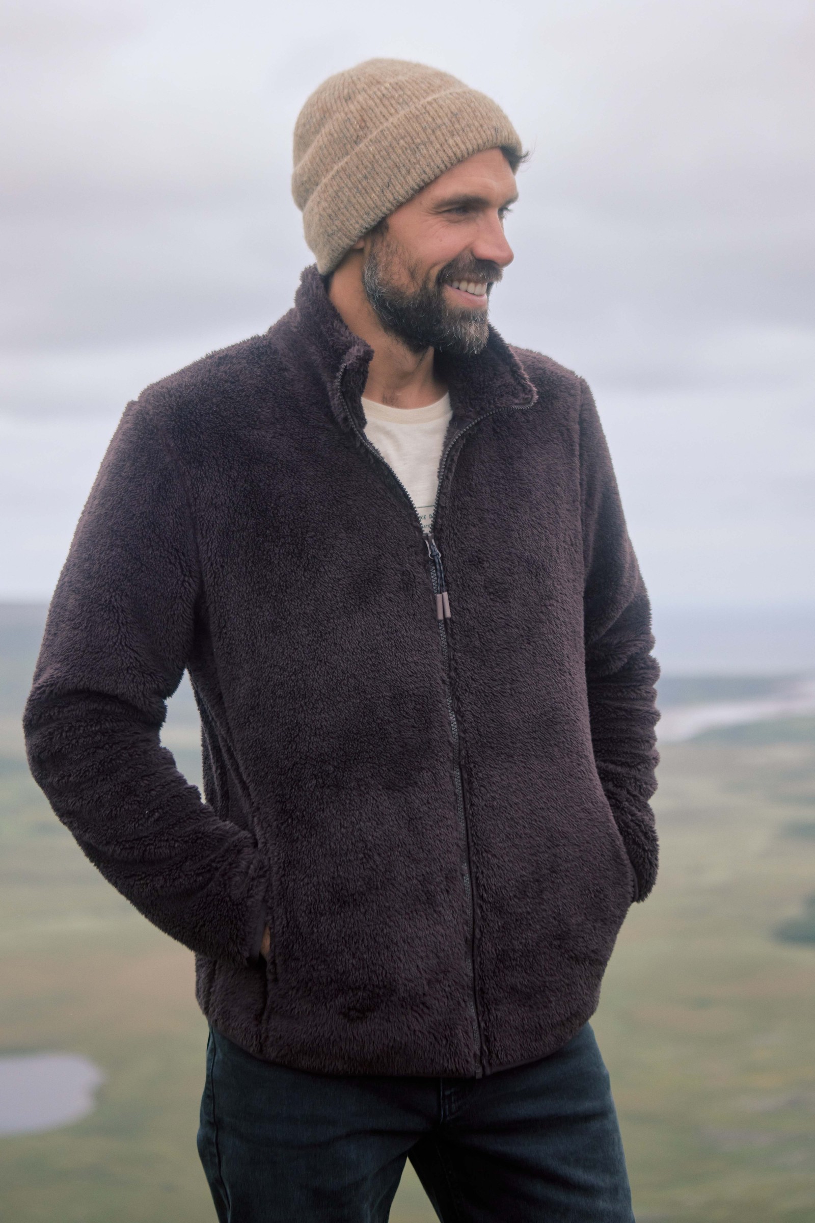 Man wearing the Weird Fish Channing cosy full zip fleece in Black Coffee