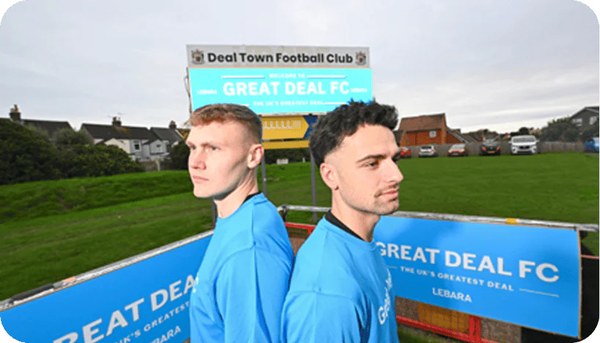 Two footballers in blue kits at a Lebara Great Deal FC pitch